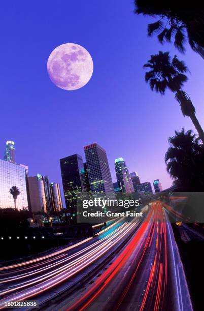 night view of freeway and skyline. - la skyline stock pictures, royalty-free photos & images