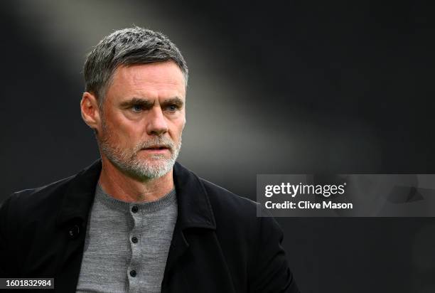 Graham Alexander, Manager of Milton Keynes Dons on the touchline ahead of during the Carabao Cup First Round match between MK Dons and Wycombe...