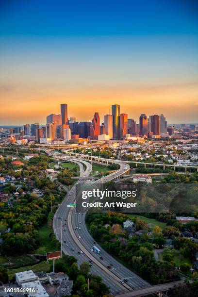 houston skyline at sunset - houston stock pictures, royalty-free photos & images