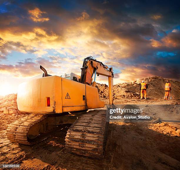 excavator at construction site - digging machine stock pictures, royalty-free photos & images