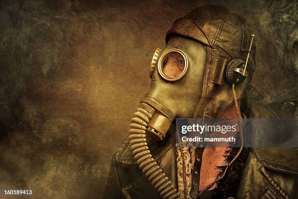 post apocalyptic survivor in gas mask - steampunk stock pictures, royalty-free photos & images