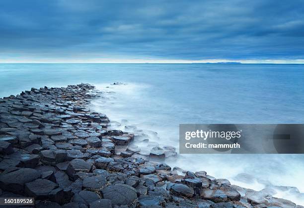 giant's causeway on a cloudy day - giant's causeway stock pictures, royalty-free photos & images