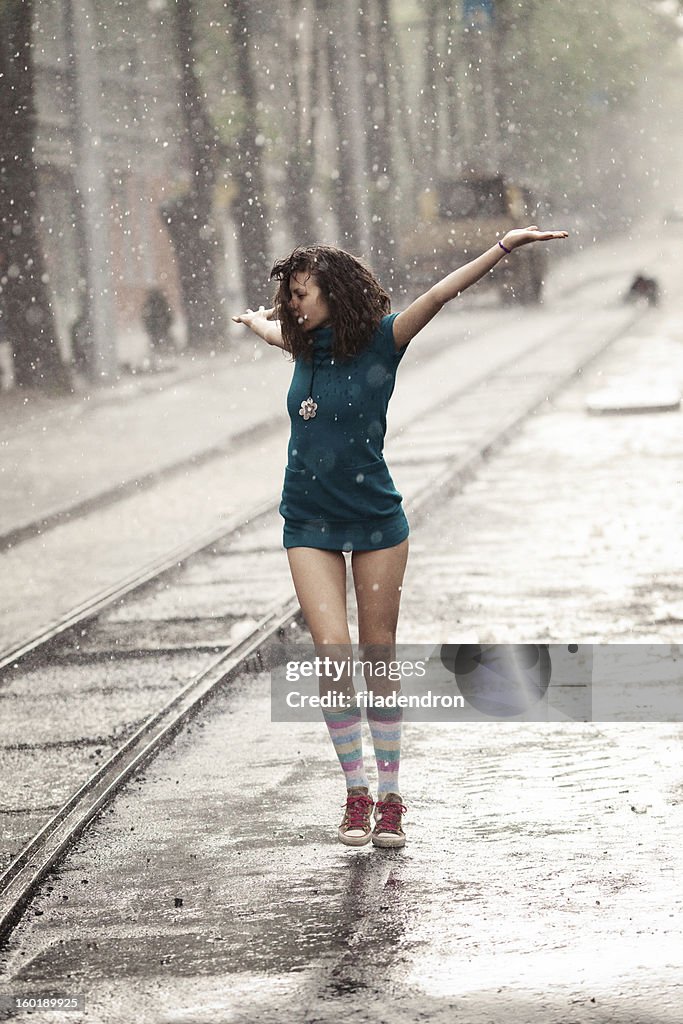 Woman under rain