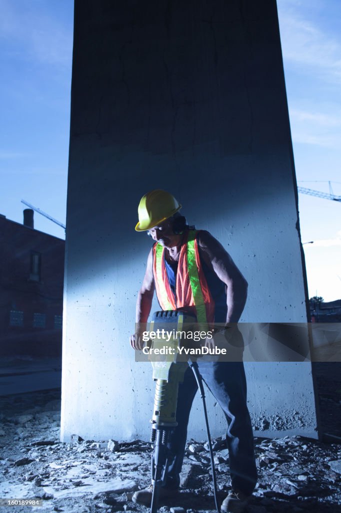Worker using jackhammer