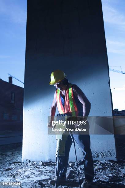 worker using jackhammer - jackhammer stock pictures, royalty-free photos & images