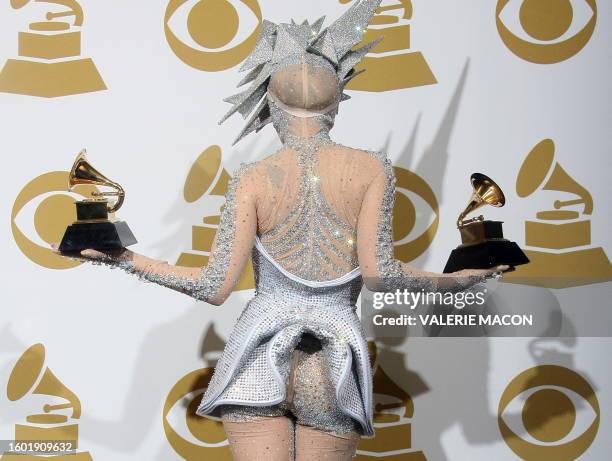 Lady Gaga poses with her awards during the 52nd annual Grammy Awards in Los Angeles, California on January 31, 2010. AFP PHOTO / VALERIE MACON