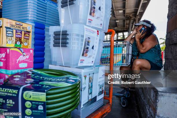 Kahului, Maui, Monday, August 14, 2023 - Melissah Shishido gathers supplies at Costco while phoning friends, requesting more goods to be delivered to...