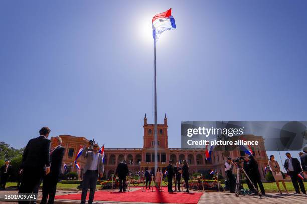 August 2023, Paraguay, Asunción: The flag of Paraguay flies in front of the government palace on the day of the swearing-in of the new president....