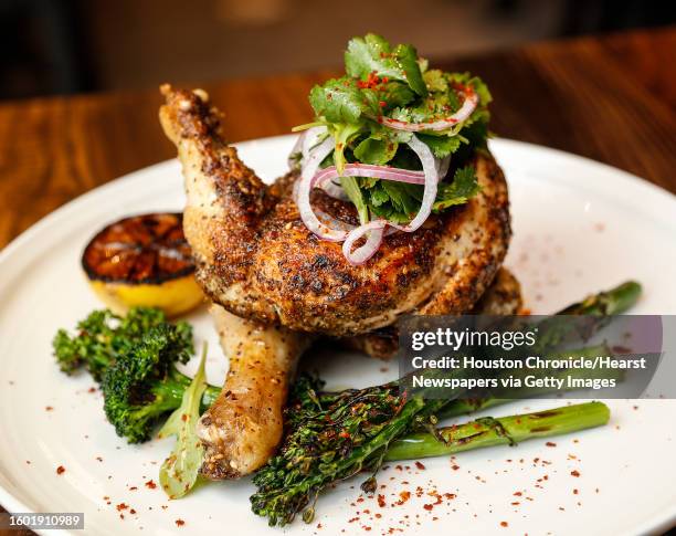 Za'atar Roasted Chicken: Roasted half chicken, grilled broccolini, cilantro salad and Aleppo pepper at Warehouse 72,Monday, July 8 in Houston....