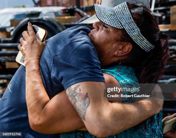 Kahului Maui, Monday, August 14, 2023 - Melissah Shishido hugs a donor while gathering supplies at Costco for Lahaina residents.