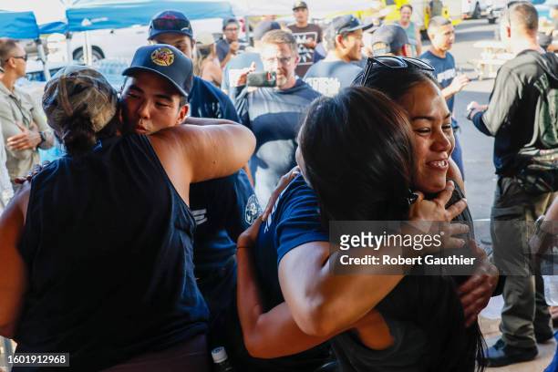 Lahaina, Maui, Monday, August 14, 2023 - Volunteers greet Hawaii federal firefighters at the home of Archie Kalepa who has given over his house, yard...