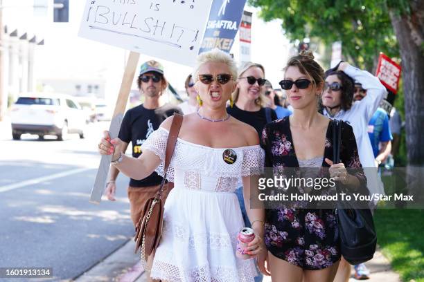 Florence Pugh walks the picket line in support of the SAG-AFTRA and WGA strike at Disney Studios on August 15, 2023 in Burbank, California.