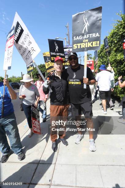 Bob Odenkirk and Cedric Yarbrough walk the picket line in support of the SAG-AFTRA and WGA strike at Paramount Studios on August 15, 2023 in...