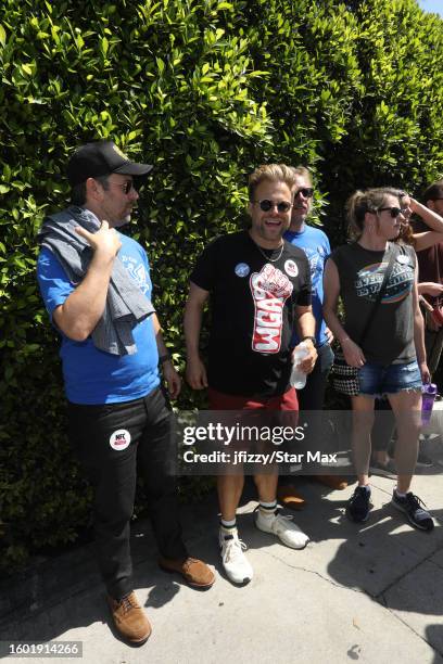Adam Conover walks the picket line in support of the SAG-AFTRA and WGA strike at Paramount Studios on August 15, 2023 in Hollywood, California.
