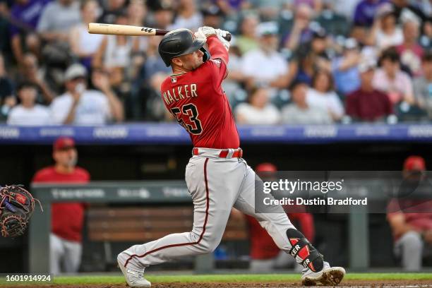 Christian Walker of the Arizona Diamondbacks hits a third inning two-run home run against the Colorado Rockies at Coors Field on August 15, 2023 in...