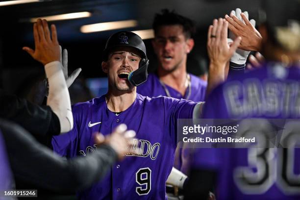 Brenton Doyle of the Colorado Rockies celebrates after hitting a seventh inning two-run home run against the Arizona Diamondbacks at Coors Field on...