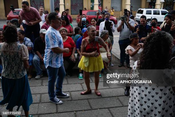 People dance in the "Libertad" square in the historical center on August 15, 2023 in San Salvador, El Salvador.