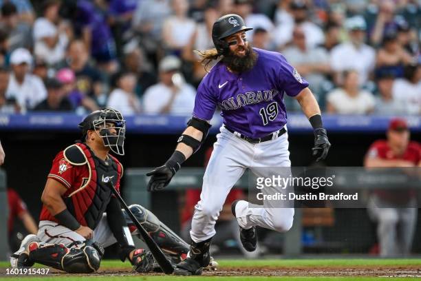 Charlie Blackmon of the Colorado Rockies hits into an RBI ground out in the third inning against the Arizona Diamondbacks at Coors Field on August...