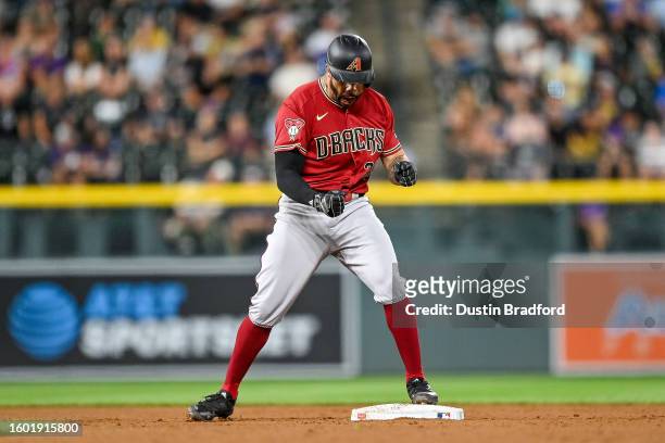 Tommy Pham of the Arizona Diamondbacks celebrates after hitting a ninth inning RBI double to go ahead against the Colorado Rockies at Coors Field on...