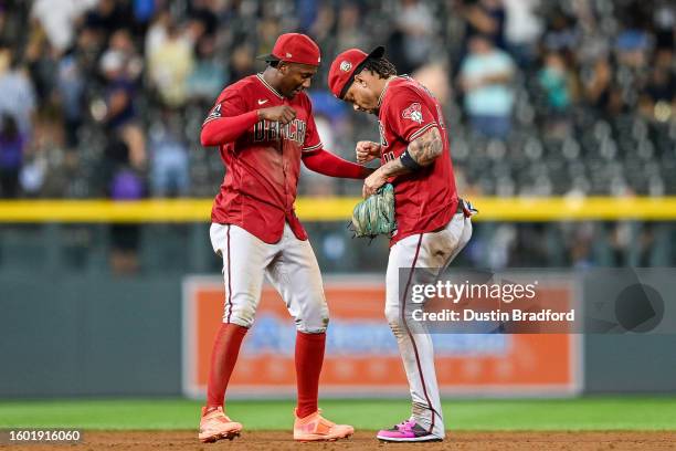 Geraldo Perdomo and Ketel Marte of the Arizona Diamondbacks celebrate after a win against the Colorado Rockies at Coors Field on August 15, 2023 in...