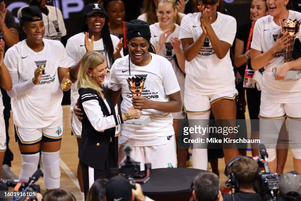 Commissioner Cathy Engelbert presents Jonquel Jones of the New York Liberty with the MVP trophy during the 2023 Commissioner's Cup Championship on...