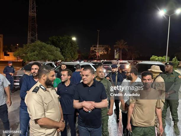Libya's Prime Minister of National Unity Government Abdul Hamid Dbeibeh accompanied by Libyan Interior Minister Emad Trabelsi inspects the scene...