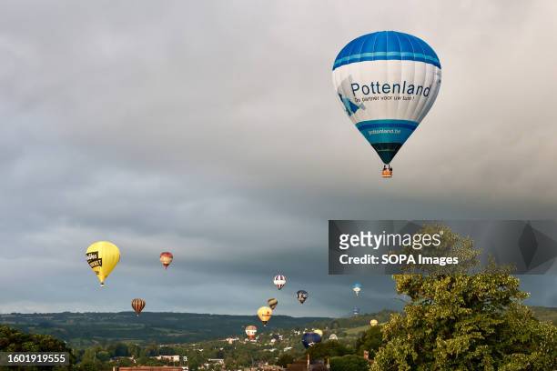 Hot air balloons seen floating over the city during the balloon festival. Bristol International Balloon Fiesta is Europe's largest hot air balloon...
