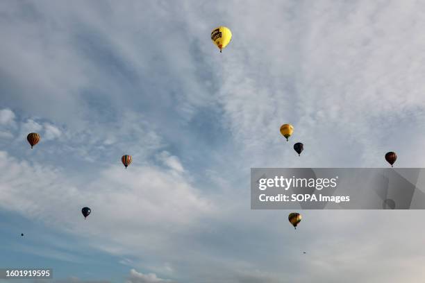 Hot air balloons seen floating over the city during the balloon festival. Bristol International Balloon Fiesta is Europe's largest hot air balloon...