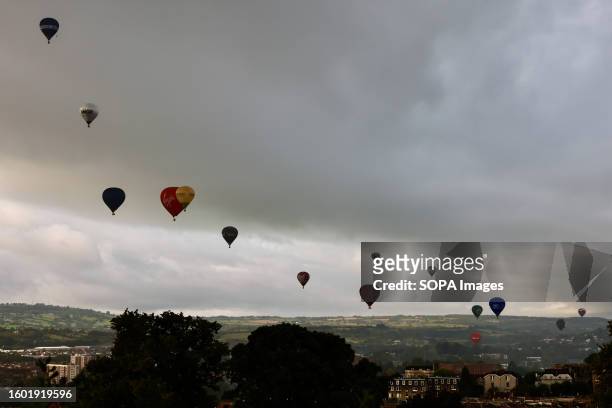 Hot air balloons seen floating over the city during the festival. Bristol International Balloon Fiesta is Europe's largest hot air balloon meeting,...