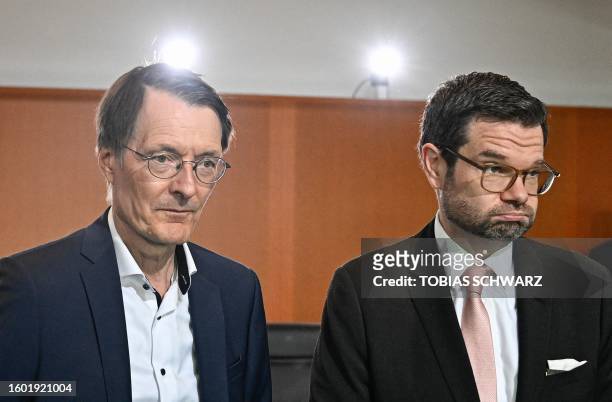 German Health Minister Karl Lauterbach and German Justice Minister Marco Buschmann react prior to the start of the weekly cabinet meeting at the...