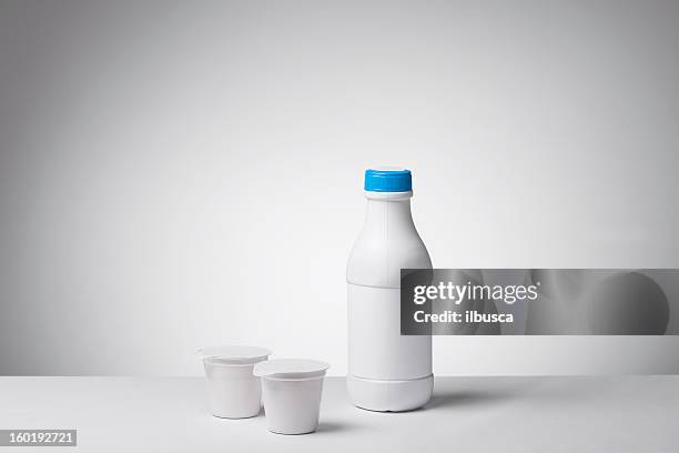 blank labeled products on neutral white to gray gradient background - yogurt container stock pictures, royalty-free photos & images