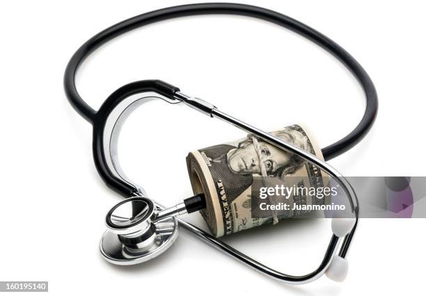 expensive healthcare - money roll stock pictures, royalty-free photos & images