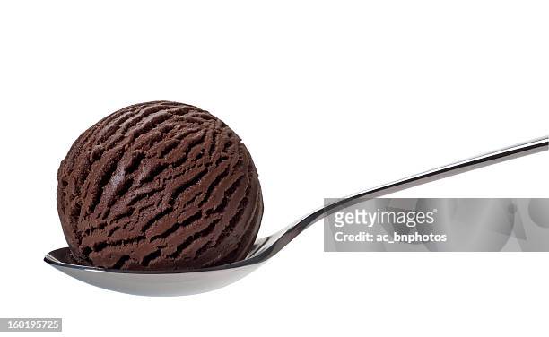 chocolate ice cream on spoon - chocoladeijs stockfoto's en -beelden