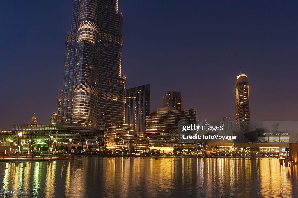 Dubai downtown lights shining in blue dusk UAE