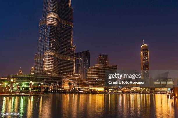dubai downtown lights shining in blue dusk uae - lakeside shopping centre stock pictures, royalty-free photos & images