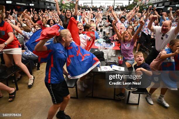 England fans celebrate the first goal as they watch the FIFA Women's World Cup Australia & New Zealand 2023 Semi Final match between England and...