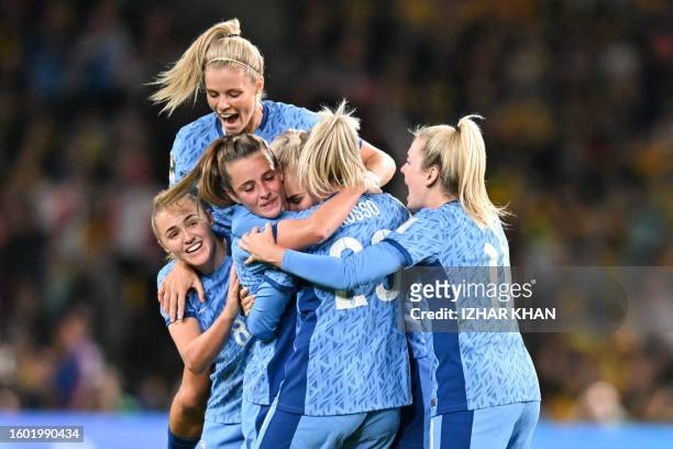 England's midfielder Ella Toone celebrates with teammates after scoring her team's first goal during the Australia and New Zealand 2023 Women's World...