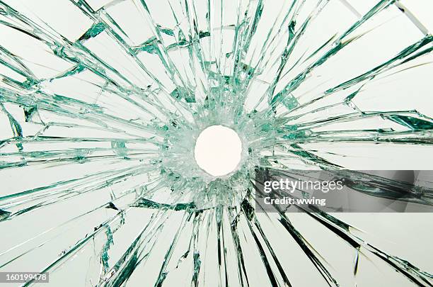 bullet hole glass - bullet hole stock pictures, royalty-free photos & images