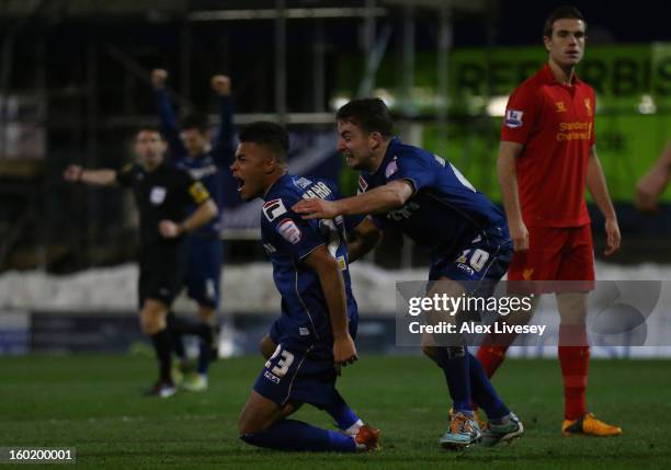 Reece Wabara of Oldham Athletic celebrates scoring his team's third goal with team-mate Jose Baxter during the FA Cup with Budweiser Fourth Round...