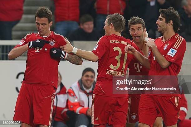 Mario Mandzukic of Muenchen celebrates scoring the opening goal with his team mates Javi Martinez , Bastian Schweinteiger and Thomas Mueller during...