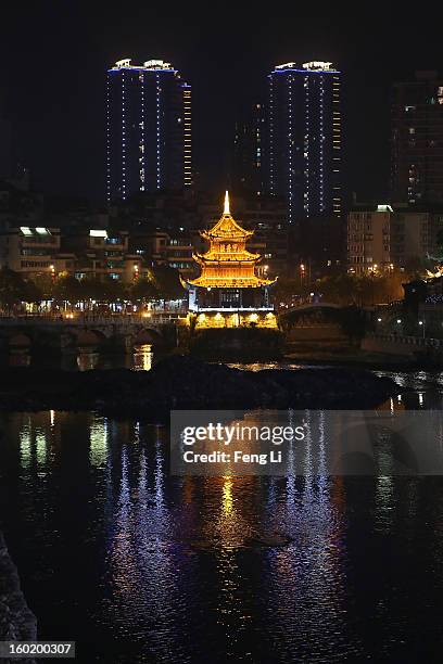 The night scene of an array of edifices and the Jiaxiulou Tower, the city's landmark ancient building for sightseeing, on January 27, 2013 in Guiyang...