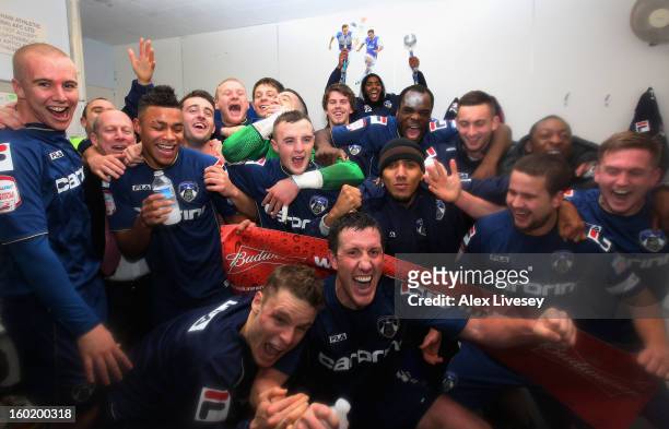 The Oldham players celebrate victory at the end of the FA Cup with Budweiser Fourth Round match between Oldham Athletic and Liverpool at Boundary...