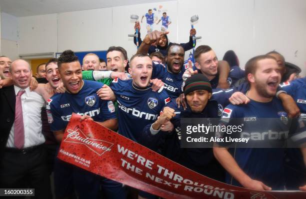 The Oldham players celebrate victory at the end of the FA Cup with Budweiser Fourth Round match between Oldham Athletic and Liverpool at Boundary...
