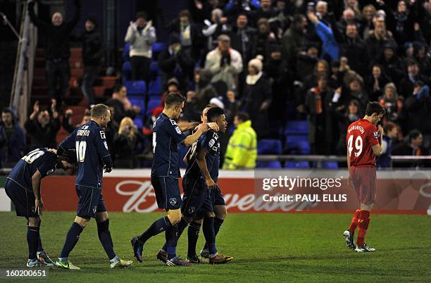 Oldham Athletic's Reece Wabara is congratulated by teammates after scoring the team's third goal during their 3-2 win in the English FA Cup fourth...