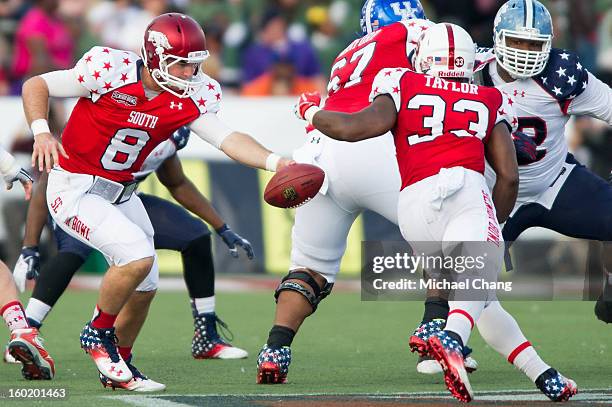 Quarterback Tyler Wilson of the South Team hands the ball off to running back Stepfan Taylor of the South Team on January 26, 2013 at Ladd-Peebles...