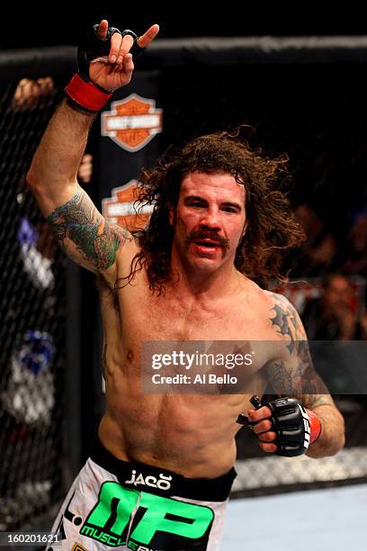 Clay Guida celebrates defeating Hatsu Hioki during their Featherweight Bout part of UFC on FOX at United Center on January 26, 2013 in Chicago,...