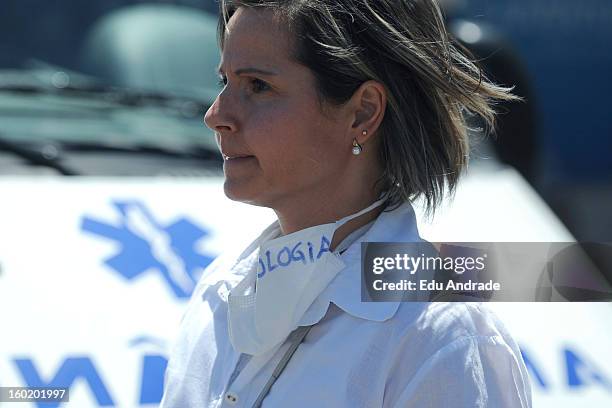 Doctor works after last night fire in Santa Maria on January 27, 2013 in Santa Maria, Brazil. Last night the nightclub Kiss caught fire killing 245...