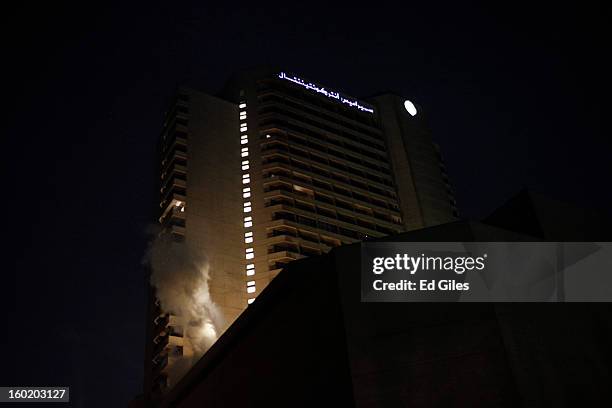 Cloud of tear gas rises from a balcony of the luxury Intercontinental Hotel after a canister fired by Egyptian riot police landed on the building...