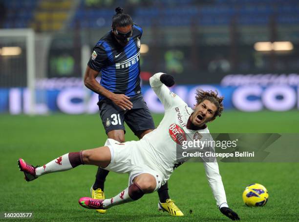 Alessio Cerci of Torino and Alvaro Pereira of Inter in action during the Serie A match between FC Internazionale Milano and Torino FC at San Siro...
