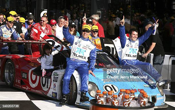 Scott Pruett and Memo Rojas co-drivers of the Chip Ganassi Racing with Felix Sabetes TELMEX/Target BMW Riley ride the caqr into Victory Lane after...